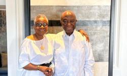 President Boakai poised in a photograph with the wife of the former Minister of State, Sylvester Grisby